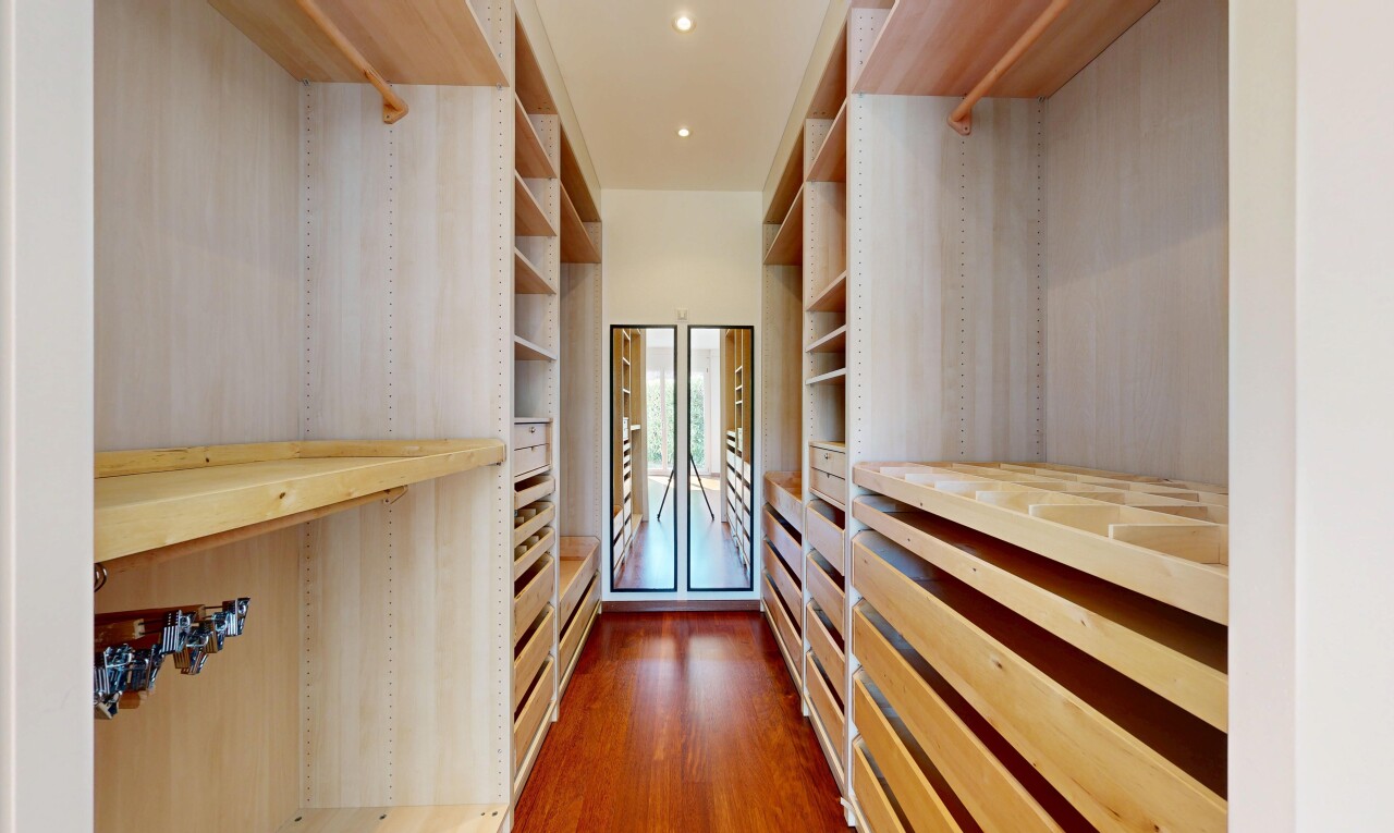 walk in closet featuring dark wood-type flooring