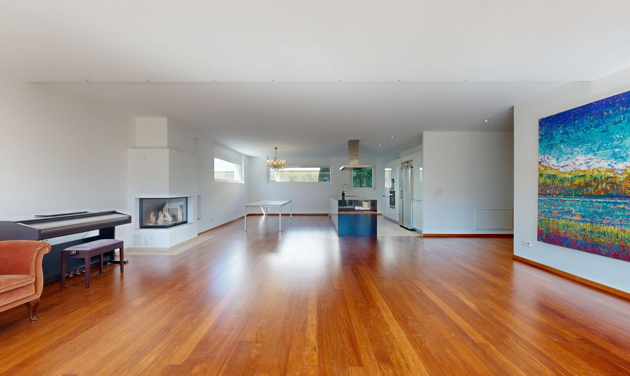 unfurnished living room with light wood-style flooring and a multi sided fireplace