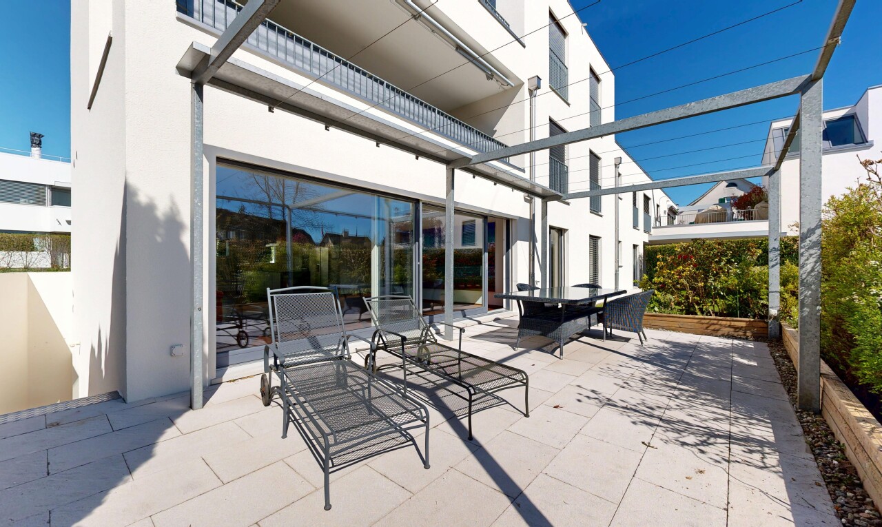 terrace with a balcony, outdoor dining space, and a patio