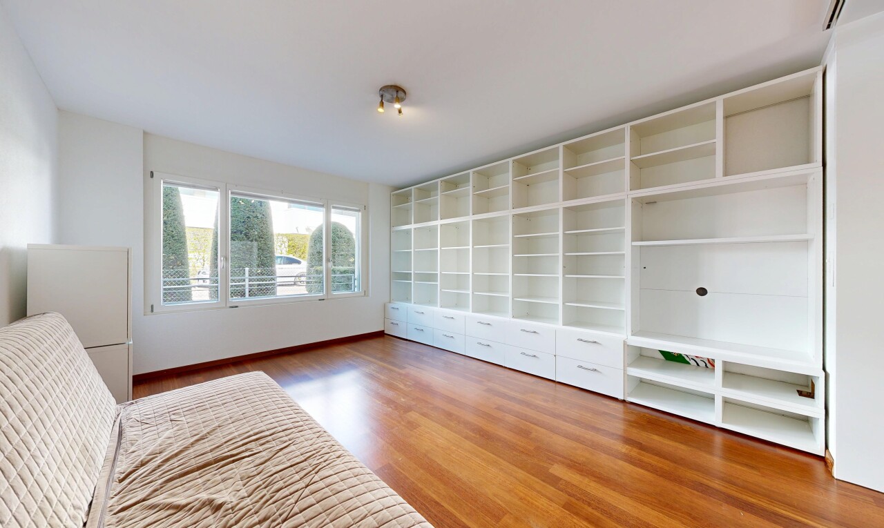 unfurnished room with light wood-style flooring and baseboards