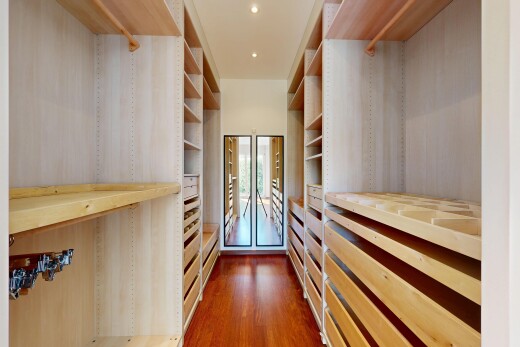 walk in closet featuring dark wood-type flooring
