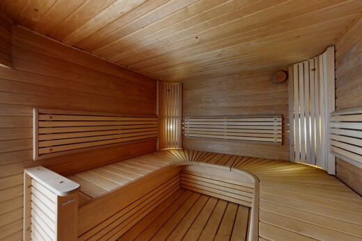 detailed view of a sauna, wooden ceiling, and wood walls