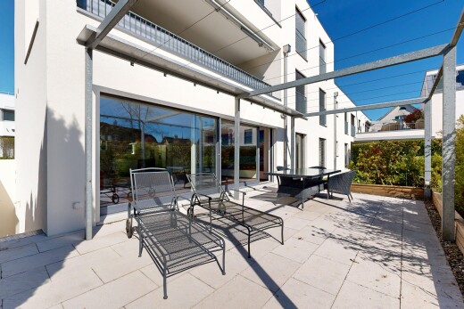 terrace with a balcony, outdoor dining space, and a patio