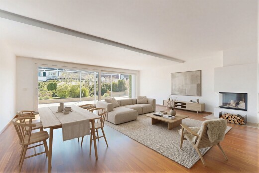 living room with light wood finished floors, beamed ceiling, and a glass covered fireplace