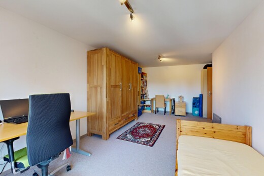 chambre avec drywall, cloison sèche, espace bureau, inside property, et carpet