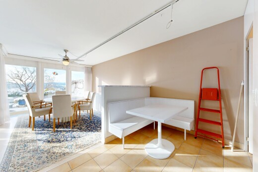 living / dining room with light tile patterned flooring and ceiling fan