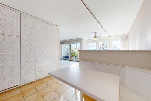 interior space featuring light tile patterned floors and ceiling fan