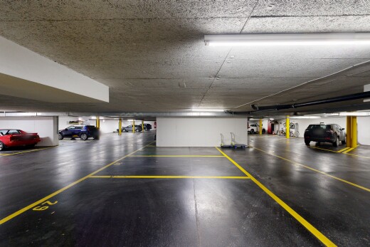 view of parking / parking lot with a parking deck