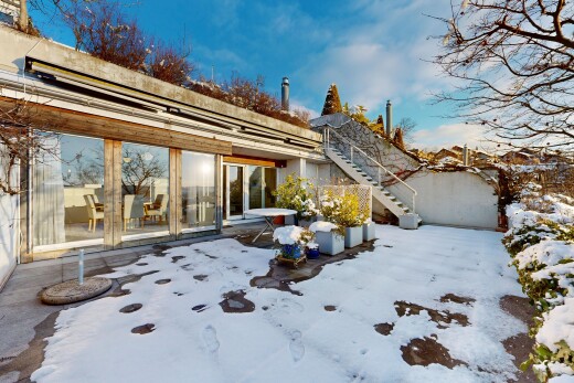 snow covered terrace featuring a patio and stairway