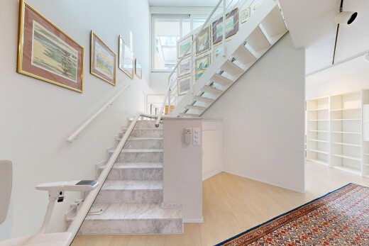 staircase featuring wood finished floors