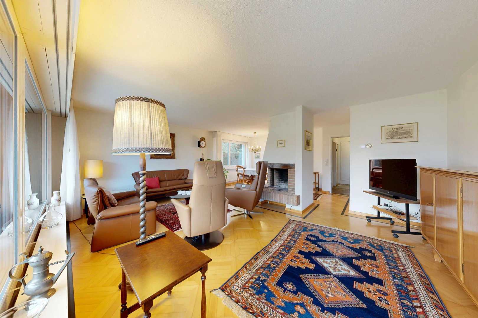 living area featuring parquet floors