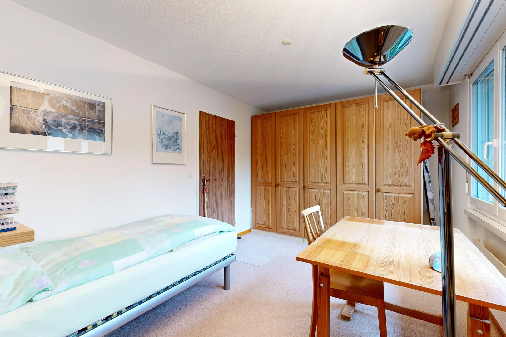 room / bedroom with a closet and light colored carpet