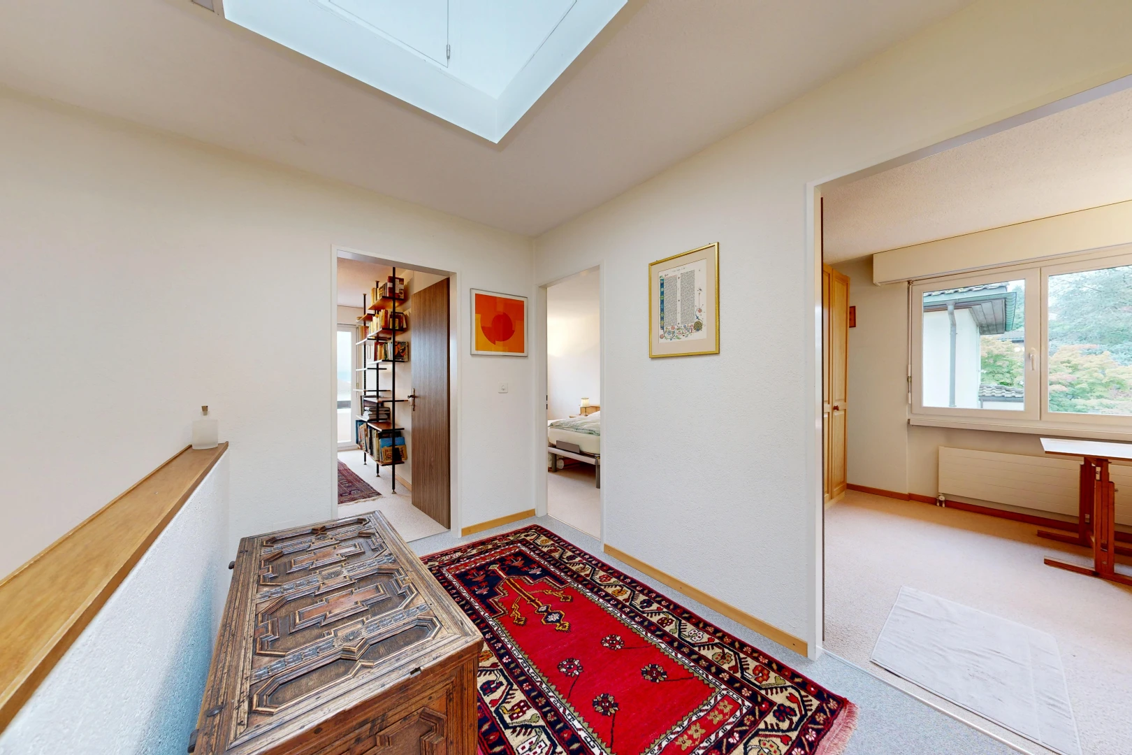 hall featuring light carpet