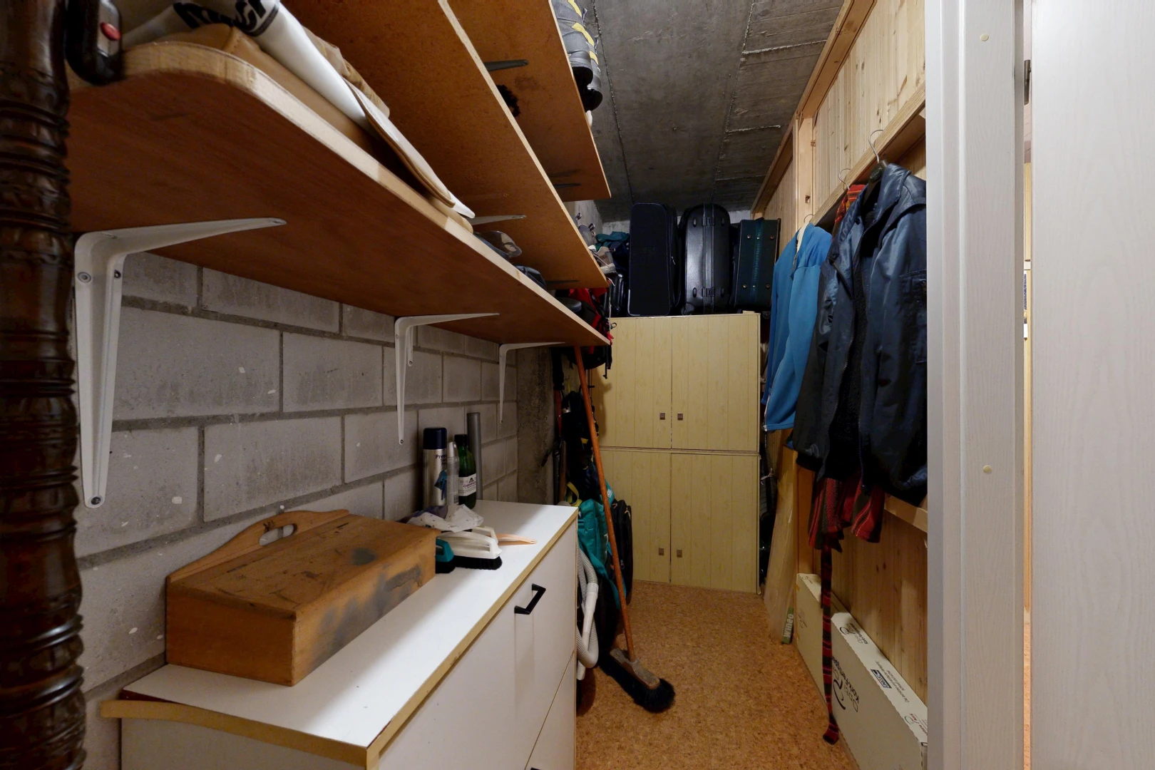 kitchen featuring concrete block wall