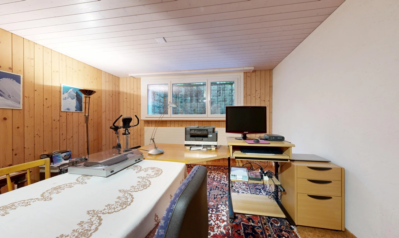 home office featuring wooden walls