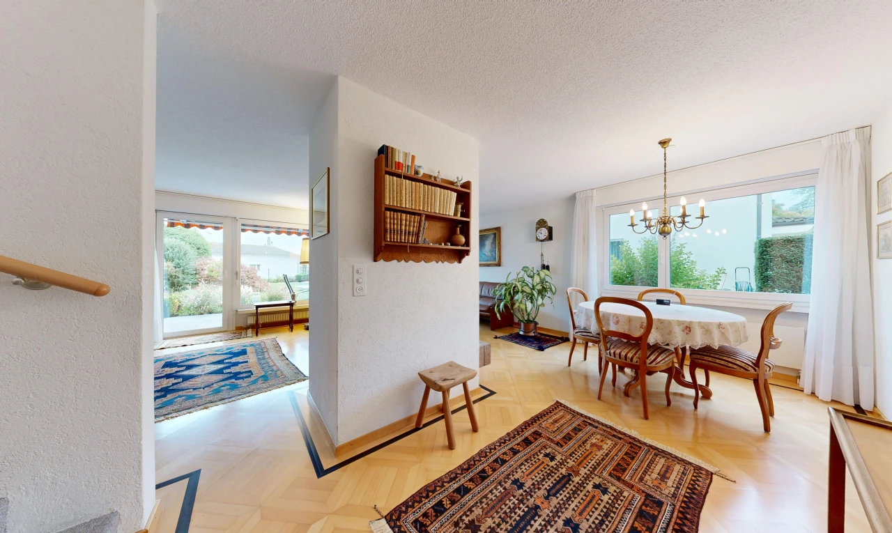 dining space with parquet floors, a textured ceiling, and access to exterior