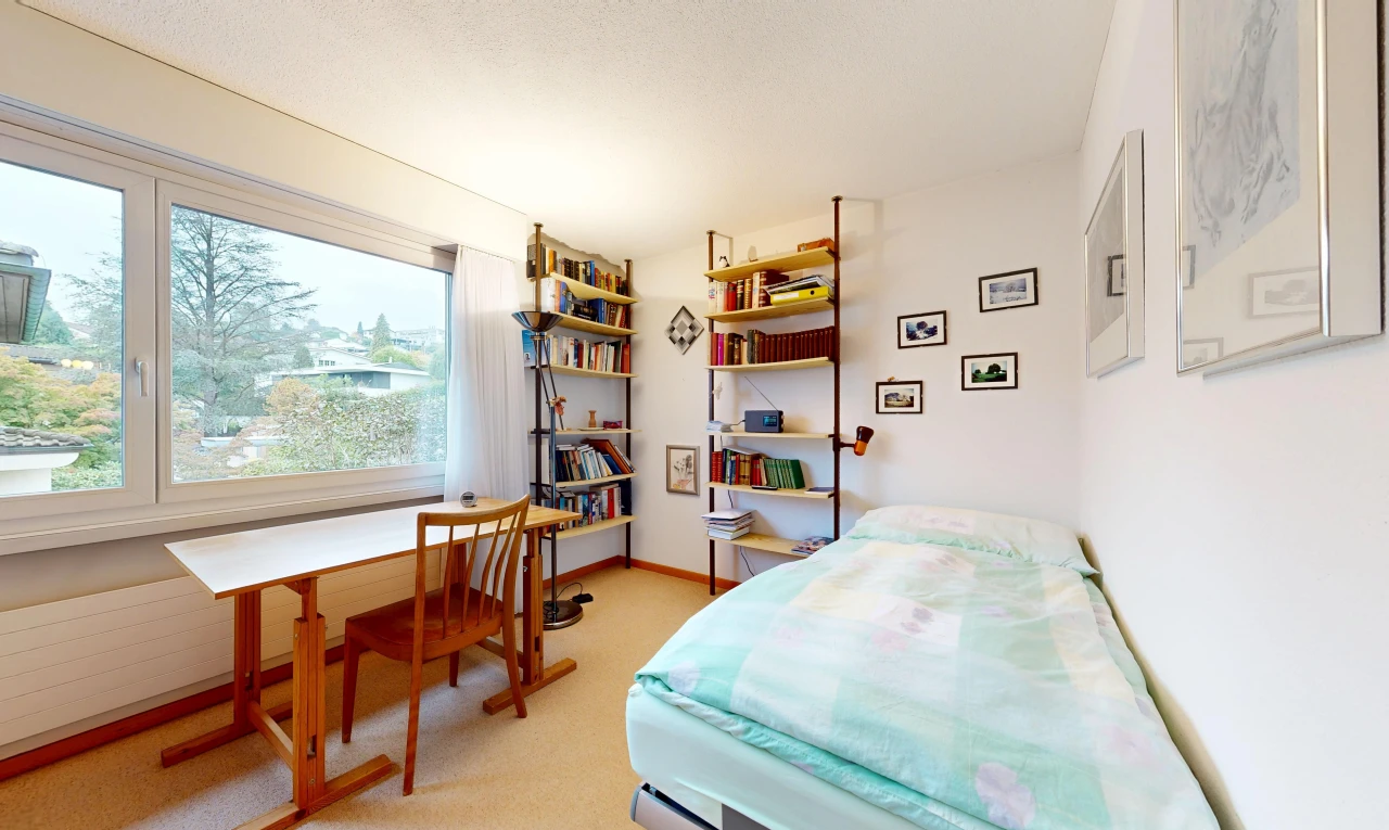 room / bedroom with a desk and light carpet