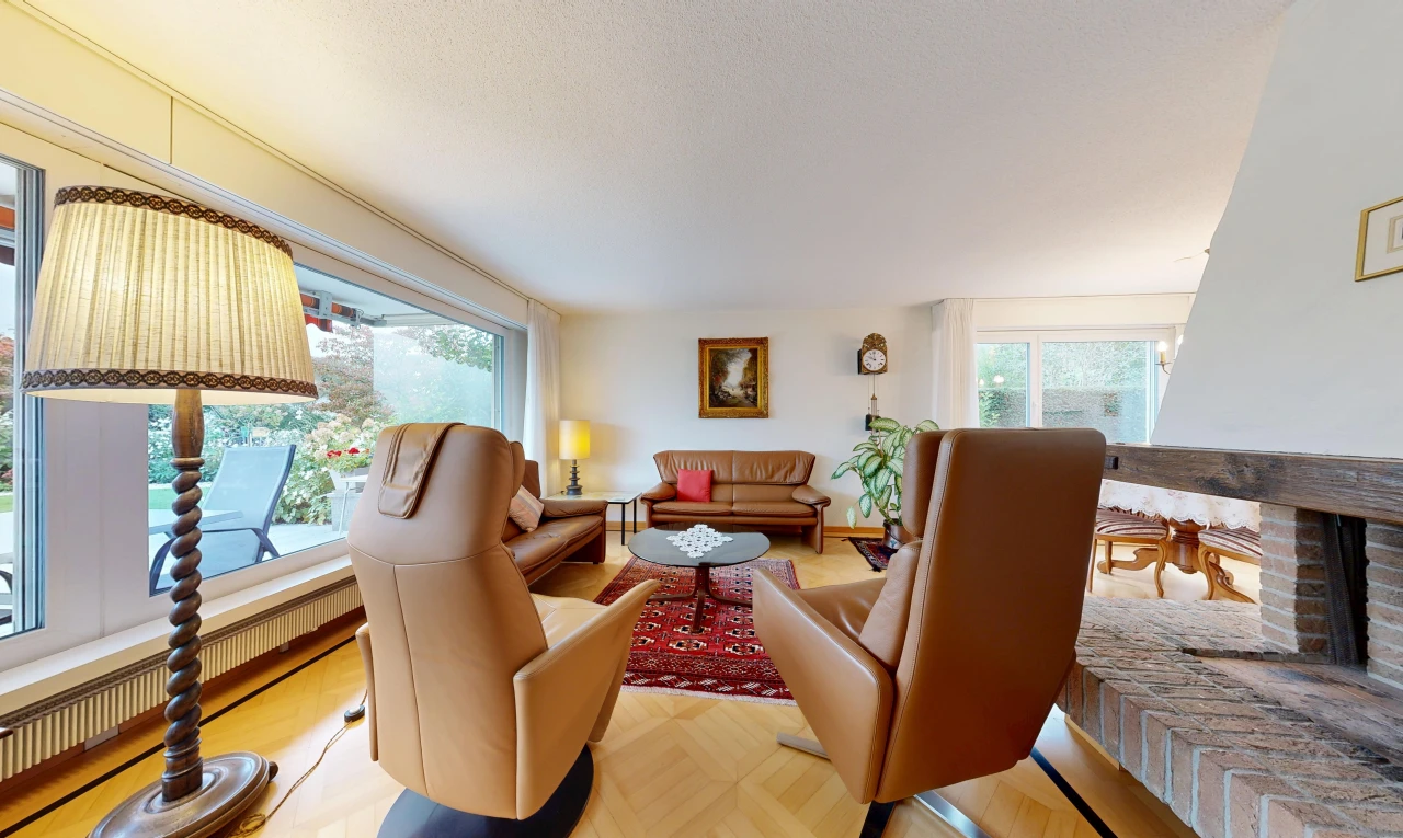 living room featuring parquet flooring and radiator heating unit