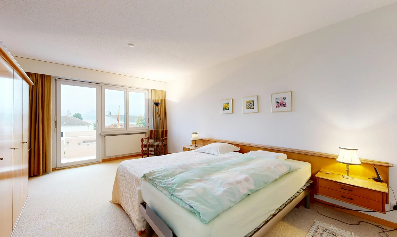 room / bedroom featuring access to exterior and light carpet