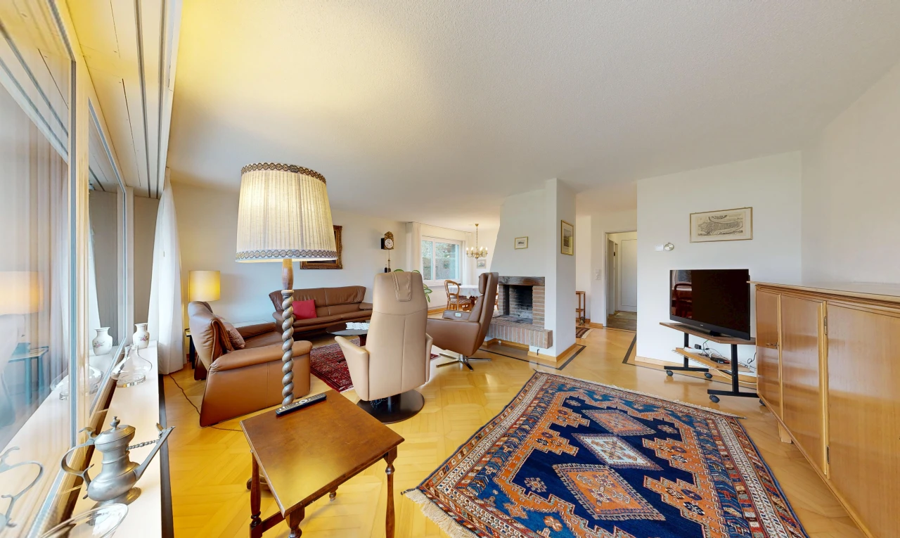 living area featuring parquet floors