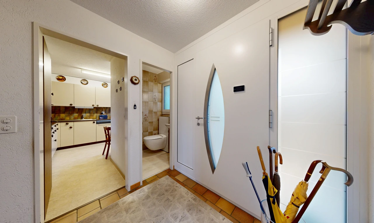 hall with a textured ceiling