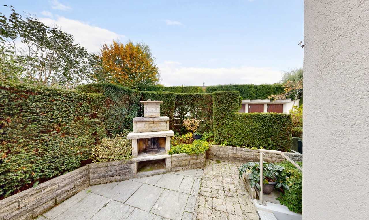 patio / terrace with a patio and an outdoor stone fireplace