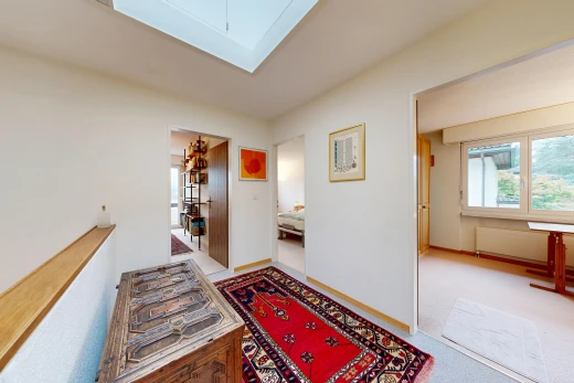 hall featuring light carpet