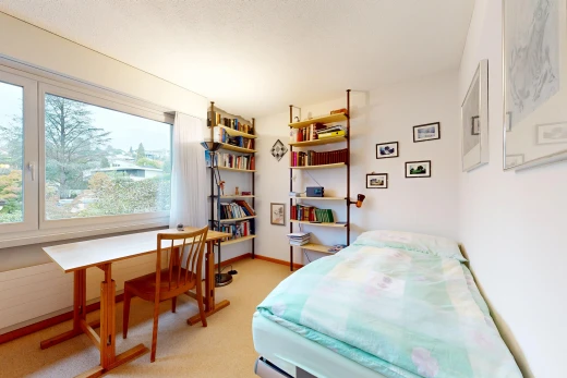 room / bedroom with a desk and light carpet