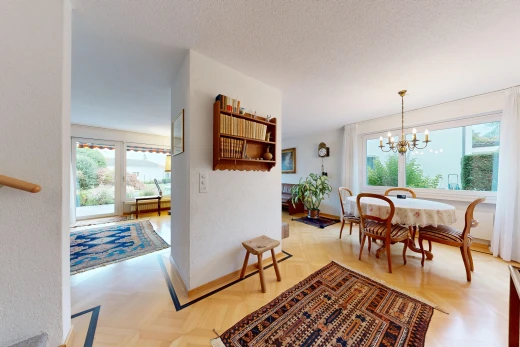 dining space with parquet floors, a textured ceiling, and access to exterior