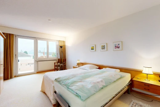 room / bedroom featuring access to exterior and light carpet