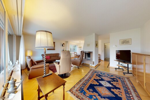 living area featuring parquet floors