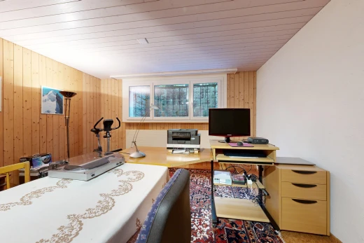 home office featuring wooden walls