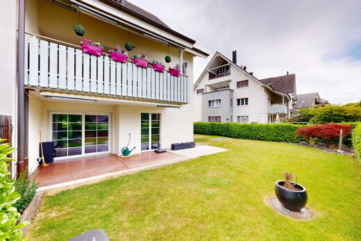 façade avec bardage en stuc, balcon, pelouse, terrasse, et from property