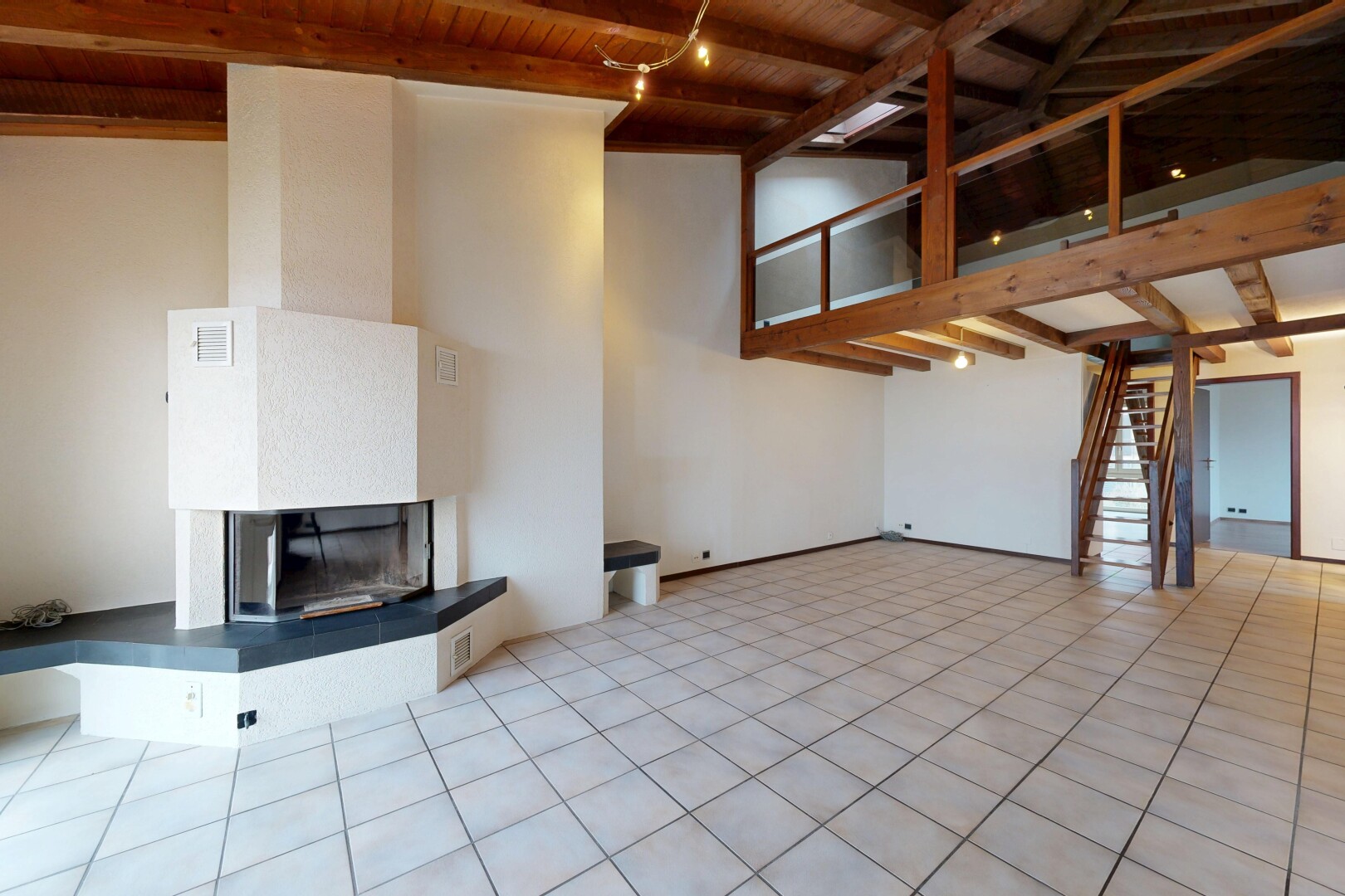 leerer raum mit kamin, balkendecke, beamed ceiling, inside property, und treppen