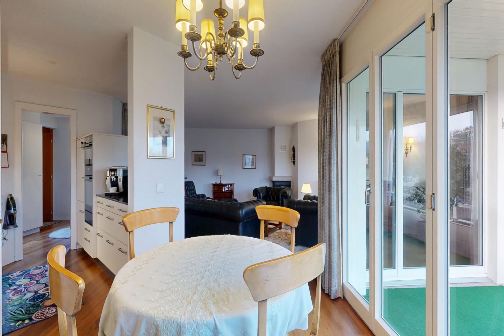 dining space with wood finished floors and hanging lights