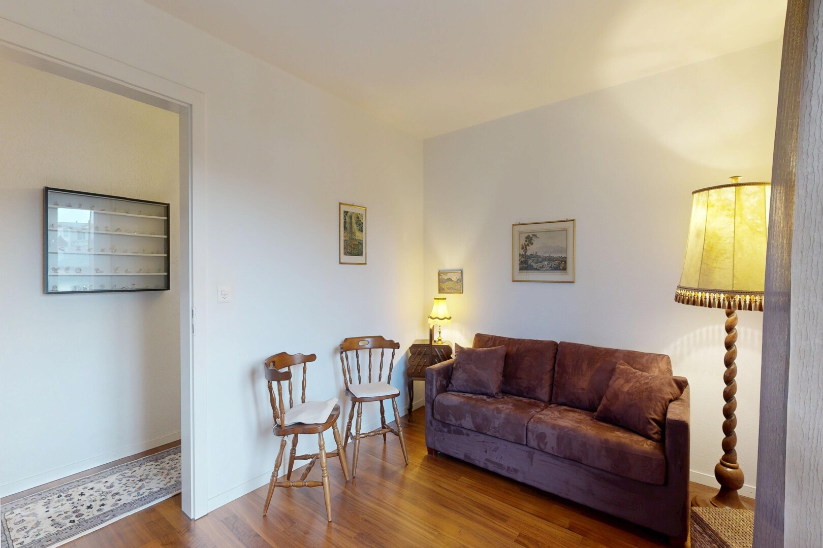 living room with dark wood finished floors and baseboards
