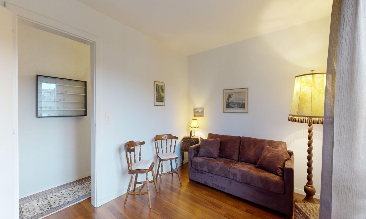 living room with dark wood finished floors and baseboards