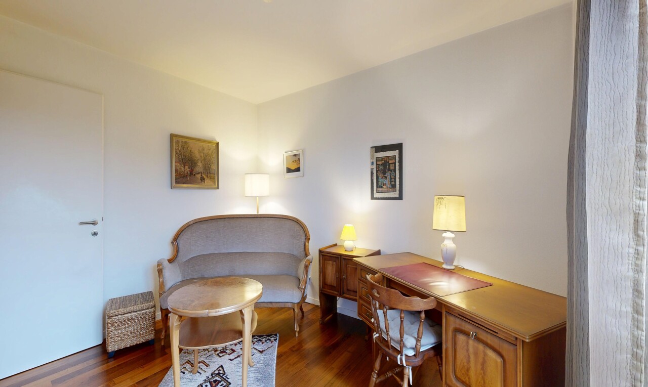 home office with dark wood-type flooring