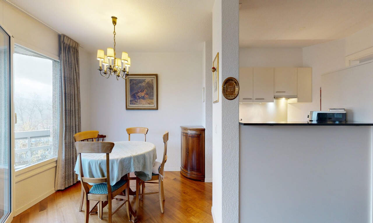 dining area featuring a chandelier and wood finished floors