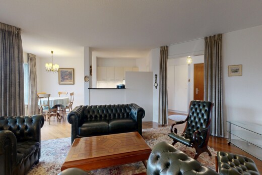 living / dining area featuring wood finished floors and a chandelier