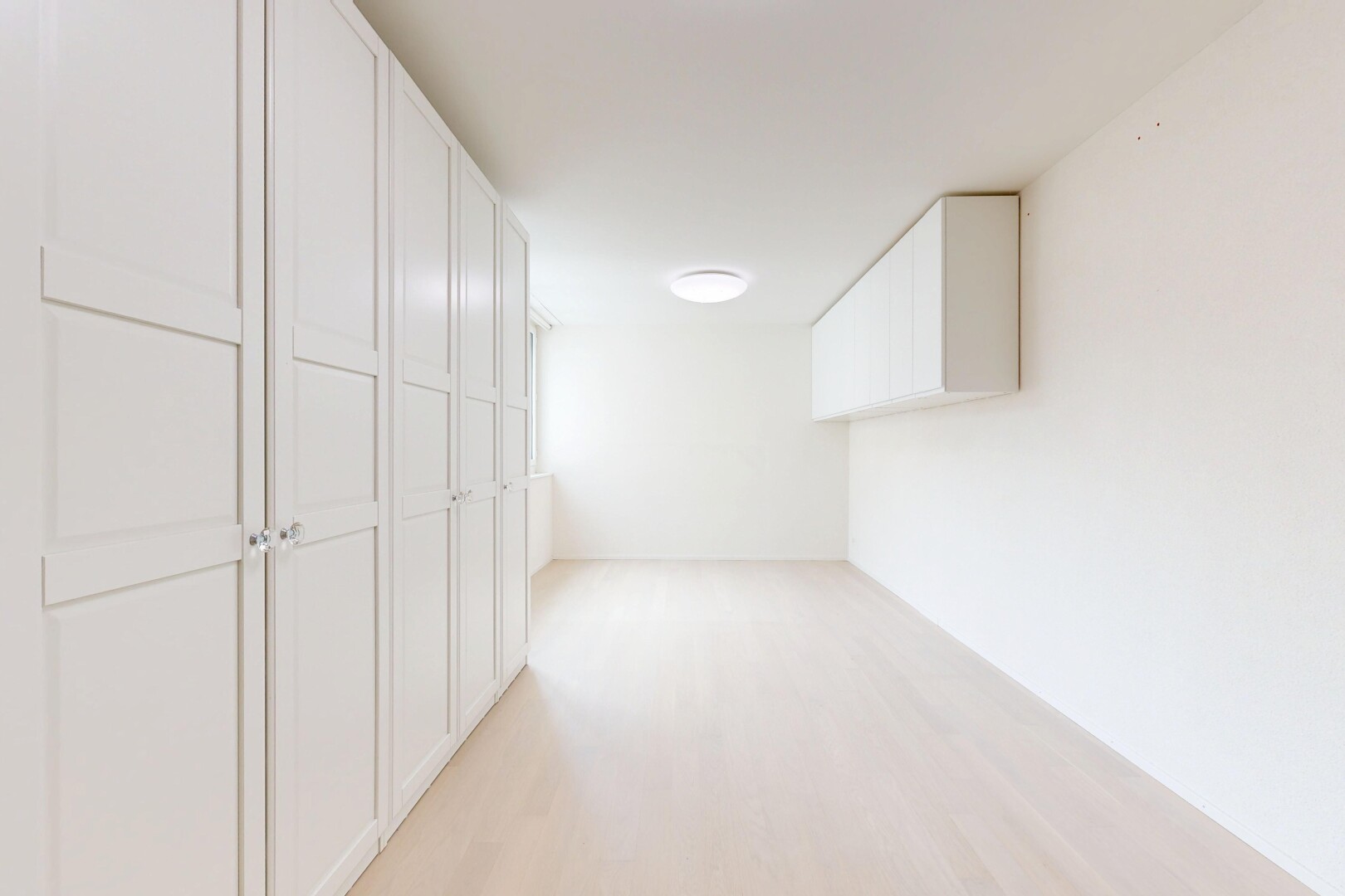 spare room with light wood-style floors