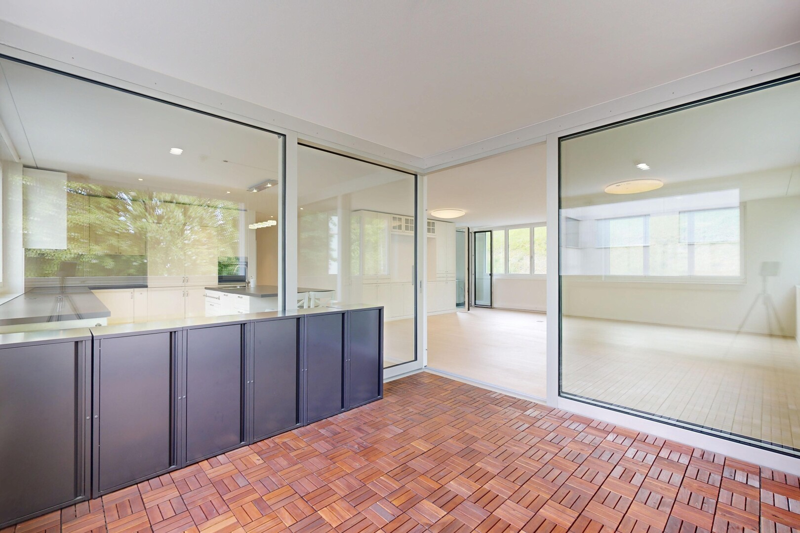 patio / terrace featuring a sunroom