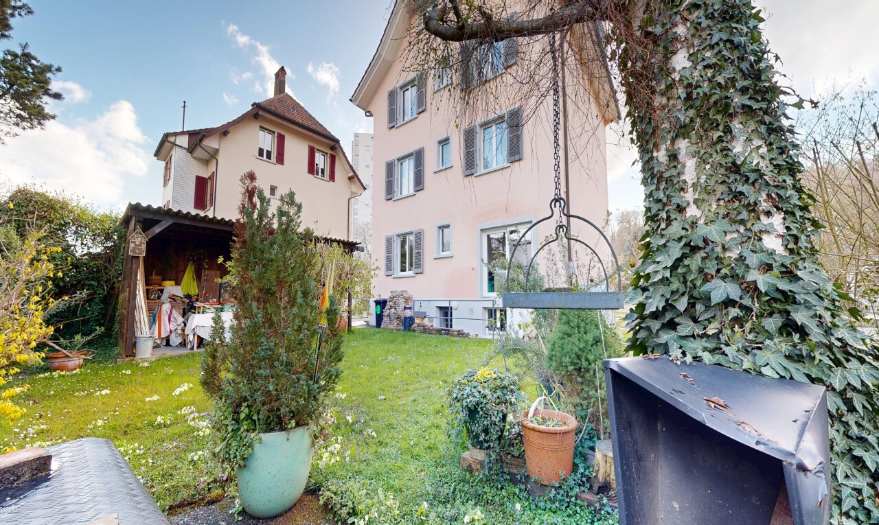 garden featuring a lawn and a patio area