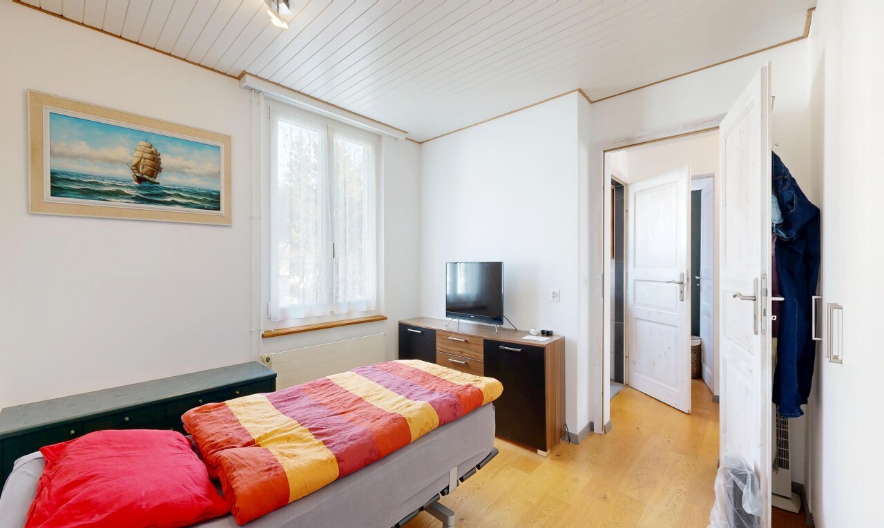 room featuring light wood finished floors and wooden ceiling