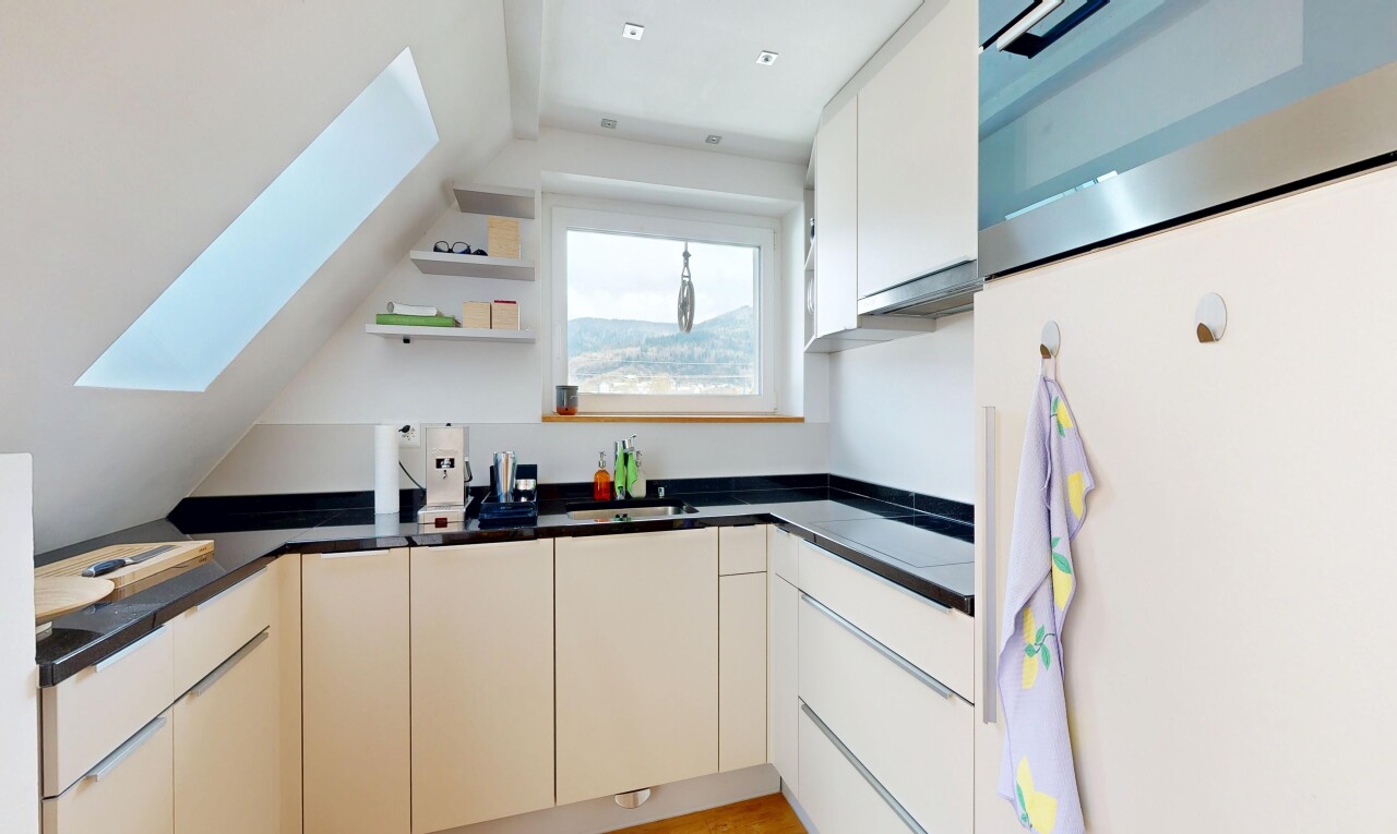 kitchen featuring freestanding refrigerator, dark countertops, vaulted ceiling, ventilation hood, and open shelves