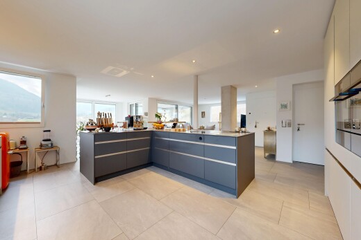 kitchen featuring modern cabinets, open floor plan, light tile patterned flooring, recessed lighting, and light countertops