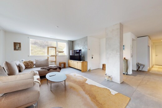 living area featuring concrete floors