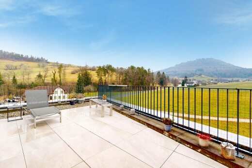 patio / terrace featuring a patio area, a mountain view, and a view of rural / pastoral area