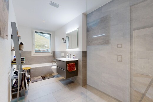 full bath with tile walls, vanity, light tile patterned flooring, a garden tub, and walk in shower