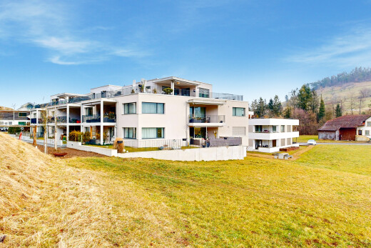 view of property featuring a yard and stucco siding
